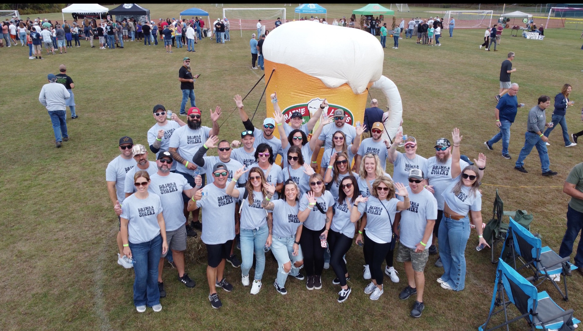 The Brewfest crew in front of the giant inflatable beer mug